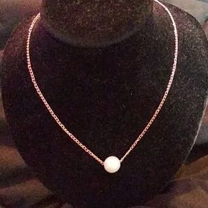 Pearl on gold strand necklace